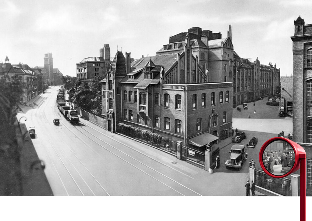 Blick auf Industriegebäude an der Wilhelminenhofstraße mit rotem Sehrohr rechts